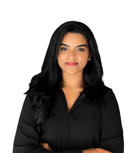 Professional headshot of a Digital Marketing Expert in Bahrain wearing a black shirt, smiling at the camera with folded arms in a modern indoor setting.